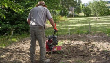 A man operating a rototiller in a garden