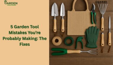 Garden tools placed on a wooden background