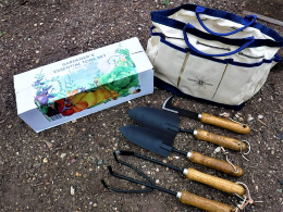Essential garden tool gift set featuring a weeder, cultivator, two spades and a garden toote bag